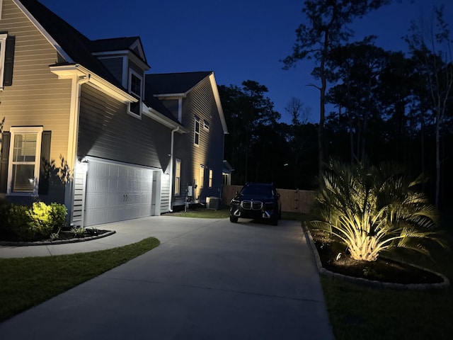 3025 Rampart Rd, Summerville, SC 29483 - property exterior at twilight featuring concrete driveway and a garage