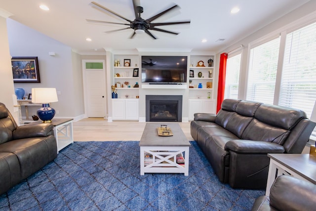 3025 Rampart Rd, Summerville, SC 29483 - living area with ceiling fan, wood finished floors, a glass covered fireplace, recessed lighting, and baseboards