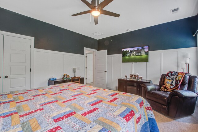 3025 Rampart Rd, Summerville, SC 29483 - bedroom featuring a decorative wall, wainscoting, a ceiling fan, and carpet floors