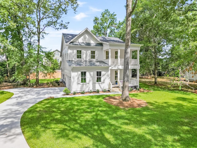 5710 Barbary Coast Rd, Hollywood, SC 29449 - view of front of house with a balcony, concrete driveway, a front lawn, and roof with shingles