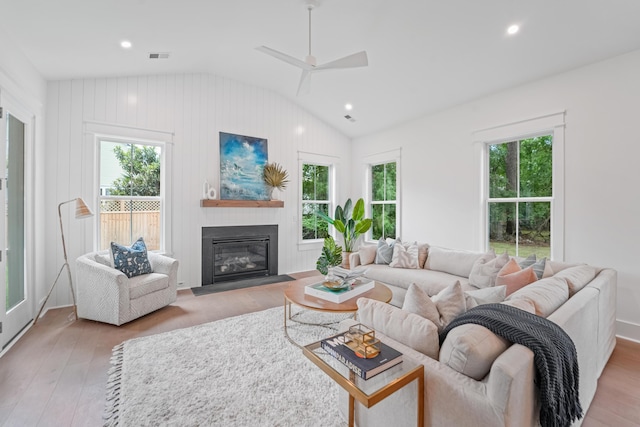5710 Barbary Coast Rd, Hollywood, SC 29449 - living area with vaulted ceiling, light wood-style flooring, a glass covered fireplace, a ceiling fan, and recessed lighting