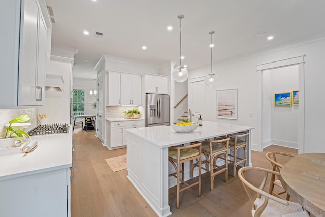 5710 Barbary Coast Rd, Hollywood, SC 29449 - kitchen with appliances with stainless steel finishes, tasteful backsplash, light countertops, white cabinets, and recessed lighting