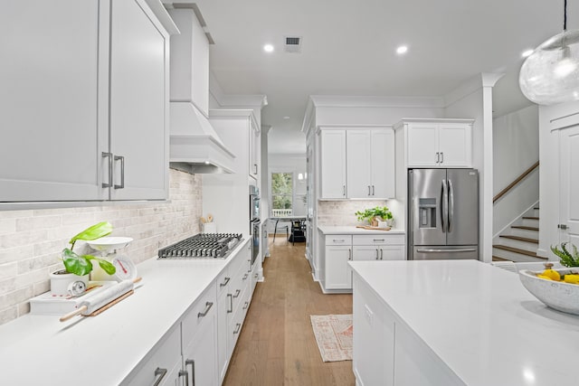 5710 Barbary Coast Rd, Hollywood, SC 29449 - kitchen with stainless steel appliances, light countertops, white cabinets, and recessed lighting