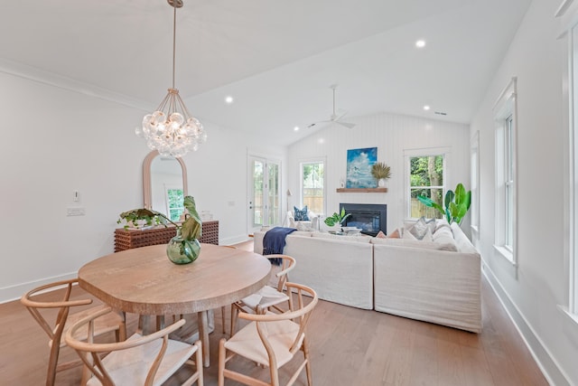 5710 Barbary Coast Rd, Hollywood, SC 29449 - dining area with light wood finished floors, plenty of natural light, a glass covered fireplace, lofted ceiling, and recessed lighting