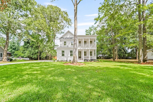 5710 Barbary Coast Rd, Hollywood, SC 29449 - view of front of home featuring a porch, a front yard, and a balcony