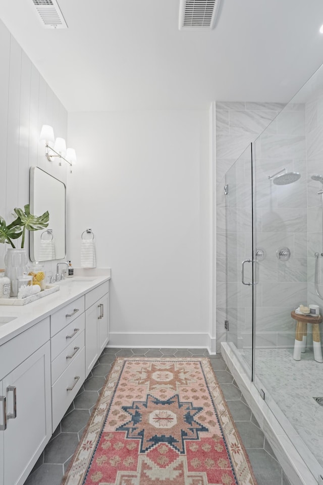 5710 Barbary Coast Rd, Hollywood, SC 29449 - bathroom featuring tile patterned flooring, double vanity, and a stall shower