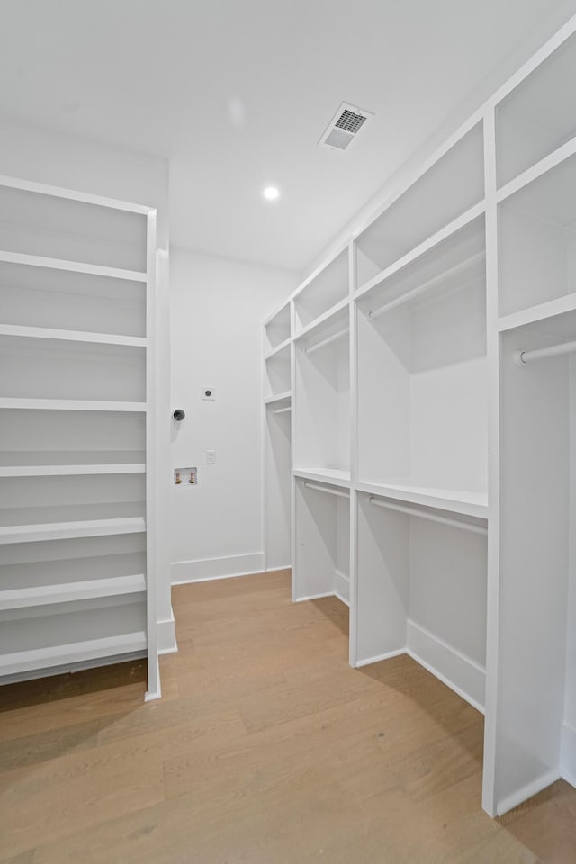 5710 Barbary Coast Rd, Hollywood, SC 29449 - walk in closet featuring wood finished floors