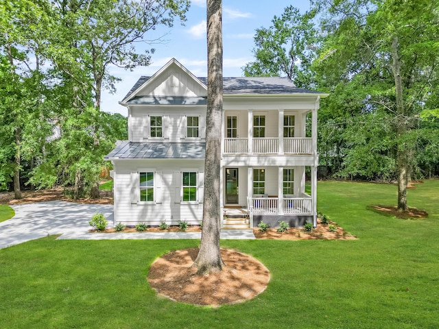 5710 Barbary Coast Rd, Hollywood, SC 29449 - greek revival inspired property with covered porch, a balcony, a front yard, and a standing seam roof