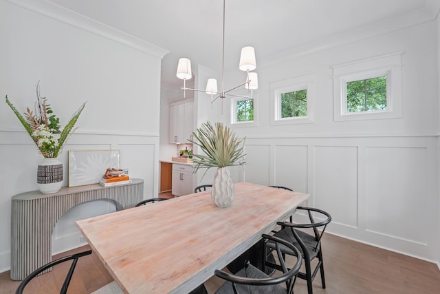 5710 Barbary Coast Rd, Hollywood, SC 29449 - dining room featuring a decorative wall, wood finished floors, healthy amount of natural light, a chandelier, and wainscoting