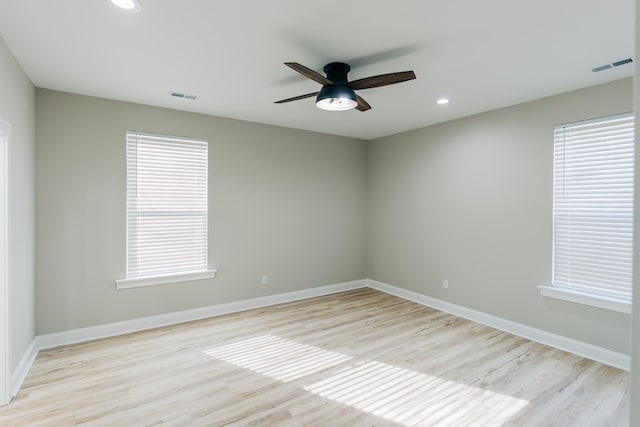 unfurnished room with light wood-style floors, a ceiling fan, recessed lighting, and visible vents
