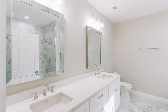 full bath featuring a sink, a marble finish shower, toilet, and marble finish floor