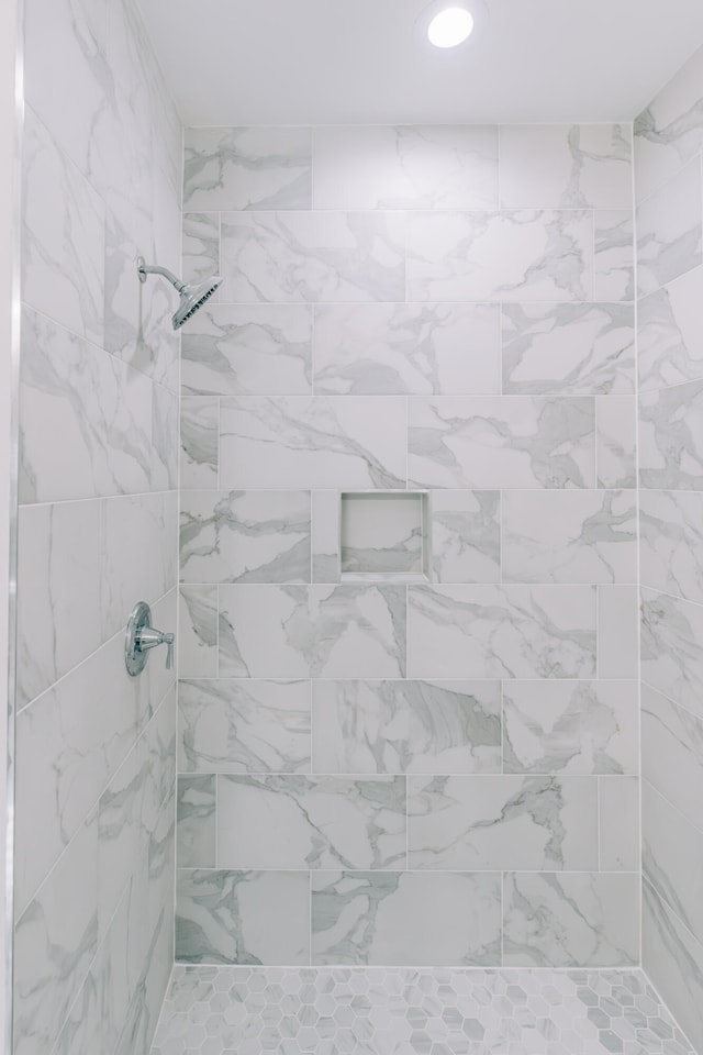full bathroom with tiled shower