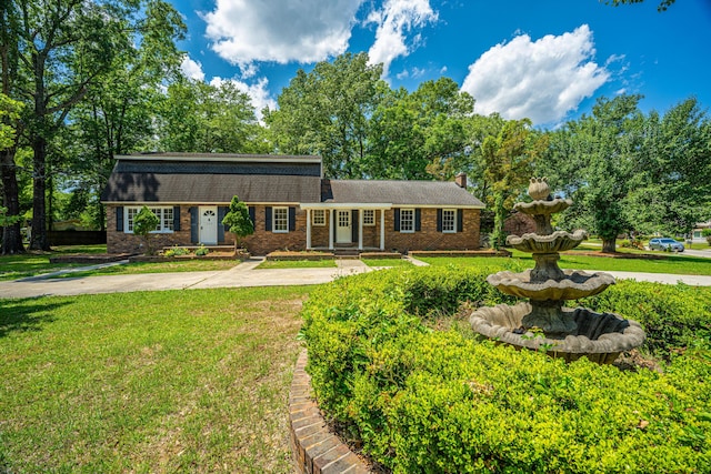 100 Colonial Dr, Goose Creek, SC 29445 - view of front of property with brick siding, a chimney, and a front yard