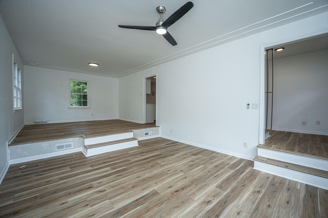 100 Colonial Dr, Goose Creek, SC 29445 - unfurnished living room with baseboards, ceiling fan, visible vents, and wood finished floors