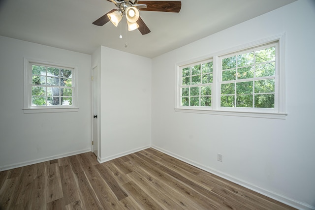 100 Colonial Dr, Goose Creek, SC 29445 - unfurnished room featuring baseboards, a ceiling fan, plenty of natural light, and wood finished floors