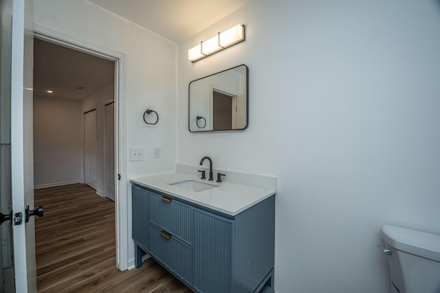 100 Colonial Dr, Goose Creek, SC 29445 - bathroom featuring toilet, baseboards, wood finished floors, and vanity