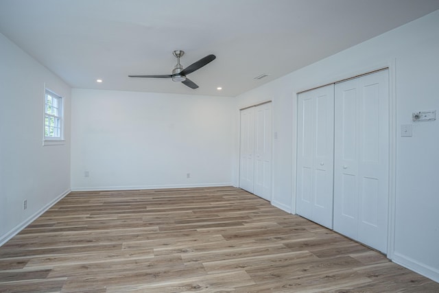 100 Colonial Dr, Goose Creek, SC 29445 - unfurnished bedroom featuring recessed lighting, two closets, baseboards, and light wood-type flooring