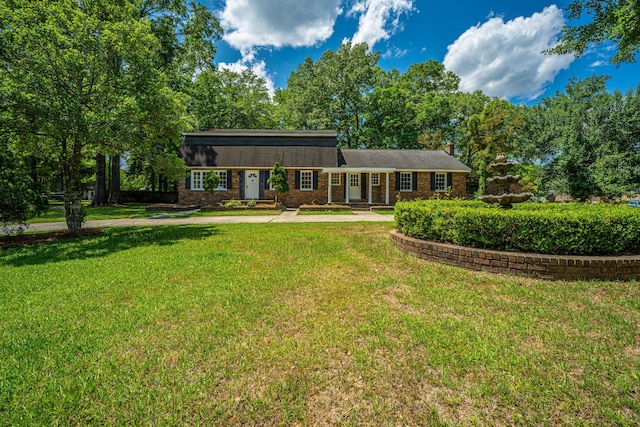 100 Colonial Dr, Goose Creek, SC 29445 - view of front of home with a chimney and a front yard