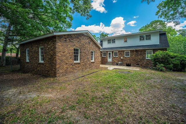 100 Colonial Dr, Goose Creek, SC 29445 - back of house featuring brick siding, fence, entry steps, and a patio
