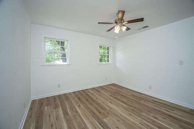100 Colonial Dr, Goose Creek, SC 29445 - spare room with baseboards, visible vents, wood finished floors, and a ceiling fan