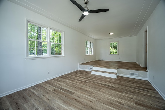 100 Colonial Dr, Goose Creek, SC 29445 - unfurnished room with baseboards, visible vents, a ceiling fan, and wood finished floors