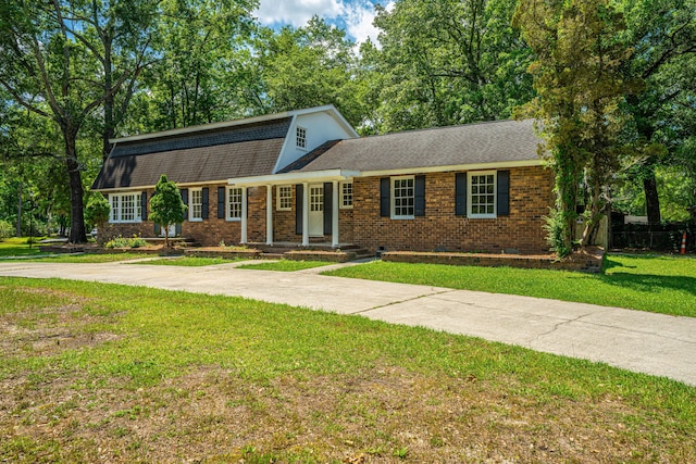 100 Colonial Dr, Goose Creek, SC 29445 - dutch colonial with roof with shingles, brick siding, driveway, crawl space, and a front lawn
