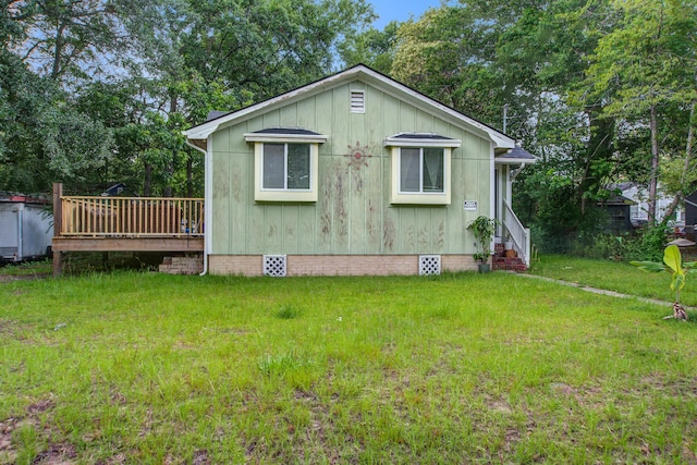 2702 Decatur St, North Charleston, SC 29405 - view of home's exterior featuring a yard, a deck, crawl space, and board and batten siding