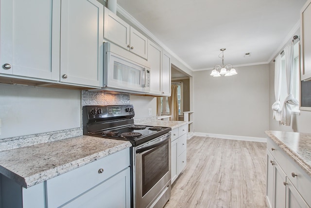2702 Decatur St, North Charleston, SC 29405 - kitchen with white microwave, electric range, a chandelier, light wood-type flooring, and crown molding
