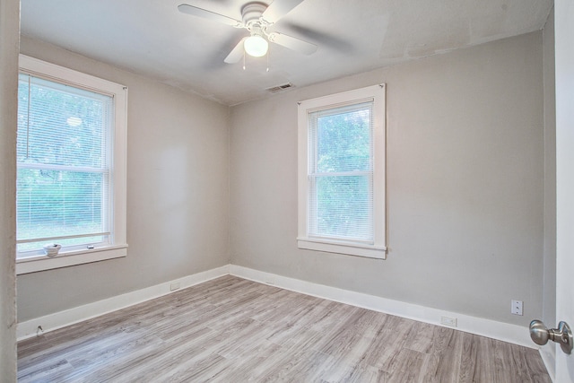 2702 Decatur St, North Charleston, SC 29405 - spare room featuring plenty of natural light, wood finished floors, and baseboards
