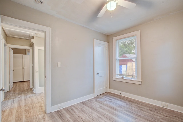 2702 Decatur St, North Charleston, SC 29405 - spare room with light wood finished floors, baseboards, ceiling fan, and attic access
