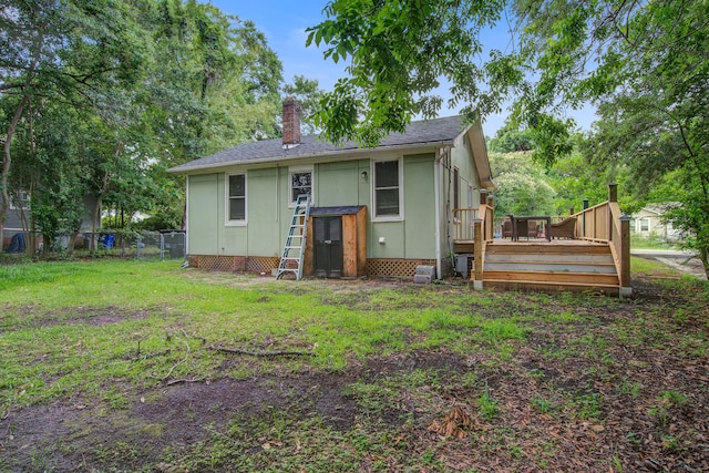 2702 Decatur St, North Charleston, SC 29405 - back of house featuring a chimney and a wooden deck