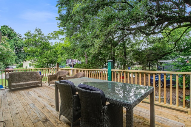2702 Decatur St, North Charleston, SC 29405 - wooden terrace featuring outdoor dining space and view of scattered trees