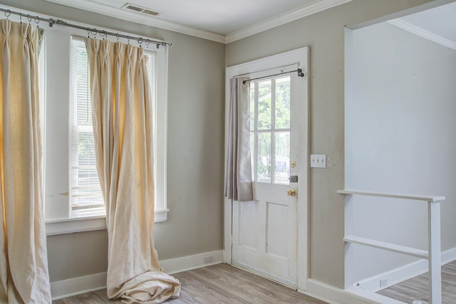 2702 Decatur St, North Charleston, SC 29405 - doorway with crown molding, wood finished floors, and baseboards