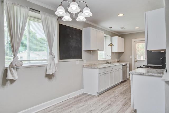 2702 Decatur St, North Charleston, SC 29405 - kitchen with white cabinets, a chandelier, a sink, ornamental molding, and light wood-type flooring
