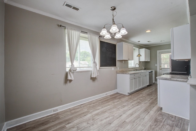 2702 Decatur St, North Charleston, SC 29405 - kitchen with crown molding, dishwasher, a chandelier, light wood finished floors, and white cabinetry