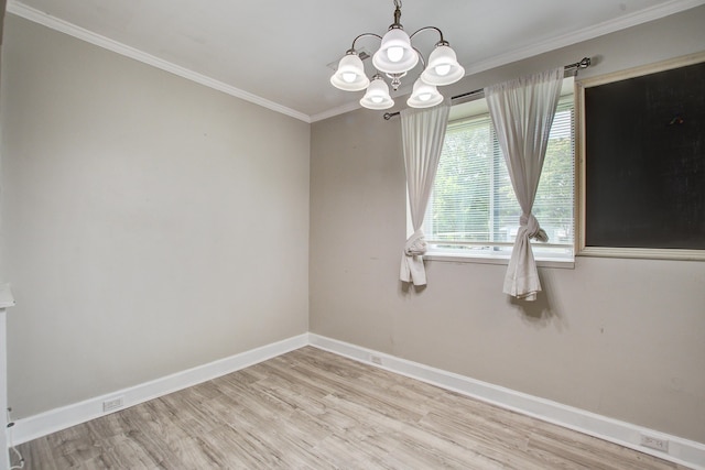 2702 Decatur St, North Charleston, SC 29405 - unfurnished room featuring light wood-style flooring, a chandelier, baseboards, and crown molding