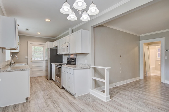 2702 Decatur St, North Charleston, SC 29405 - kitchen with appliances with stainless steel finishes, a sink, light wood-type flooring, white cabinets, and ornamental molding