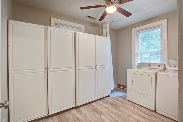 2702 Decatur St, North Charleston, SC 29405 - laundry area featuring cabinet space, washing machine and dryer, ceiling fan, and light wood finished floors