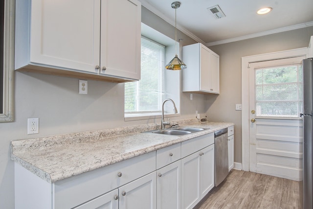 2702 Decatur St, North Charleston, SC 29405 - kitchen featuring a sink, stainless steel appliances, white cabinetry, light countertops, and crown molding