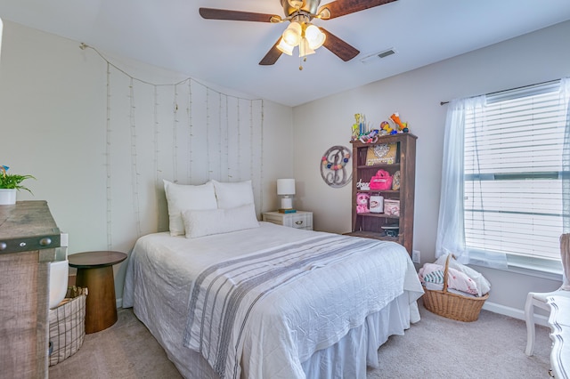 bedroom with carpet floors, a ceiling fan, and baseboards