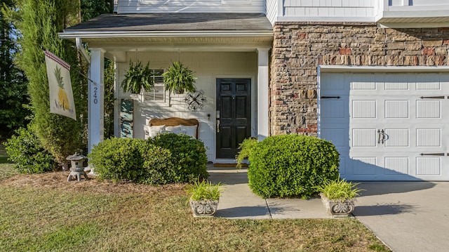 property entrance featuring stone siding, a shingled roof, a garage, and a porch