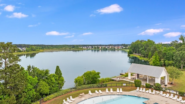 community pool with a patio, fence, a water view, and a gazebo