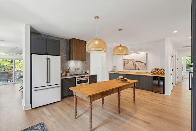 1012 E Erie Ave, Folly Beach, SC 29439 - kitchen featuring white appliances, wine cooler, light wood-type flooring, light countertops, and recessed lighting
