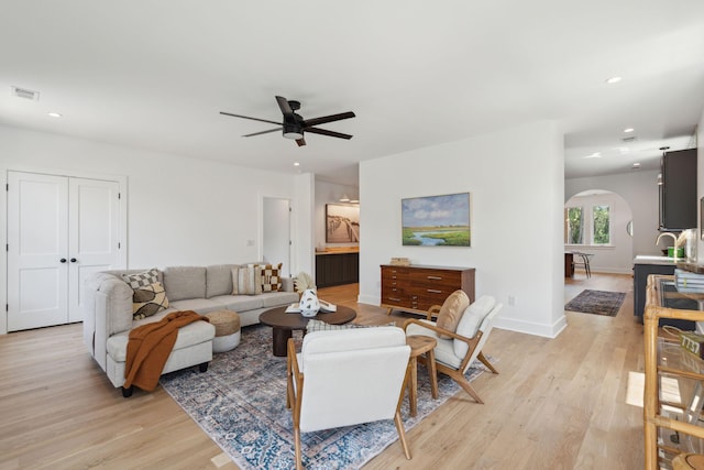 1012 E Erie Ave, Folly Beach, SC 29439 - living area with arched walkways, ceiling fan, light wood finished floors, recessed lighting, and baseboards
