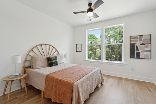 1012 E Erie Ave, Folly Beach, SC 29439 - bedroom featuring baseboards, light wood-type flooring, and a ceiling fan