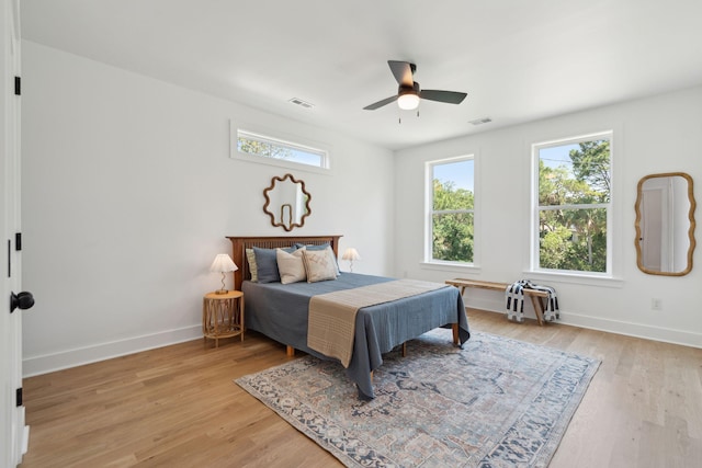 1012 E Erie Ave, Folly Beach, SC 29439 - bedroom with baseboards, light wood-type flooring, and a ceiling fan
