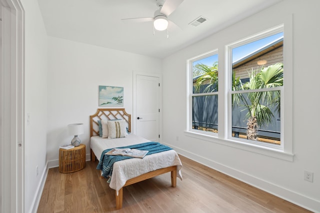 1012 E Erie Ave, Folly Beach, SC 29439 - bedroom with wood finished floors, baseboards, and ceiling fan