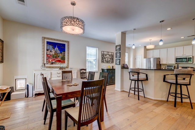 1231 Wild Olive Dr, Mount Pleasant, SC 29464 - dining space featuring light wood-style flooring, baseboards, and recessed lighting