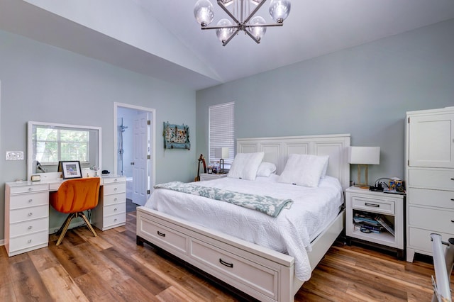 1231 Wild Olive Dr, Mount Pleasant, SC 29464 - bedroom with vaulted ceiling, a chandelier, wood finished floors, and an office area