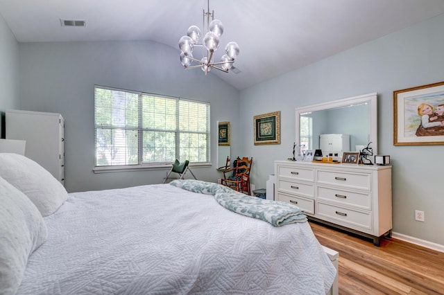 1231 Wild Olive Dr, Mount Pleasant, SC 29464 - bedroom with a chandelier, lofted ceiling, light wood-style floors, multiple windows, and baseboards